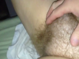 rubbing my wifes soft round hairy pussy,