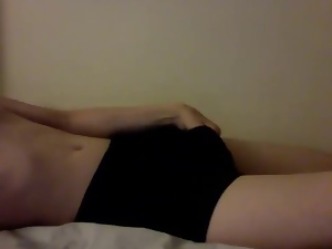 Skinny girl plating in her gym shorts