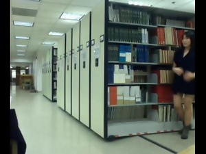 Asian teen flashes in public library