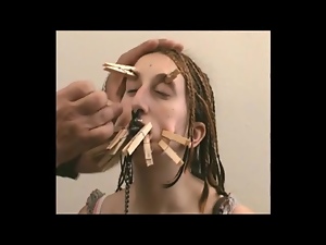 Cute amateur with clothes pins on her pretty face