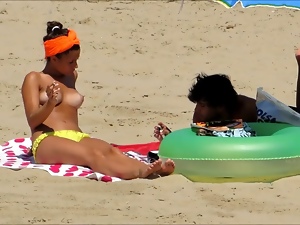 Topless teen with boyfriend at the Beach