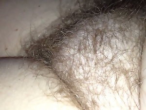 checking out her hairy pussy as she is half awake