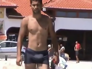 hot sexy man bulging at beach