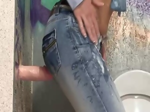 Glamorous babe in tight jeans sucks bukkake toy