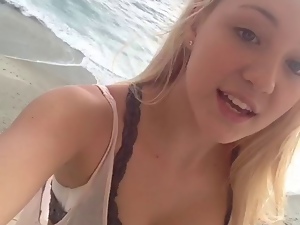 Ava at the beach house showing cleavage